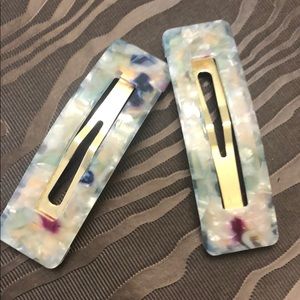 Set of two medium sized hair clip accessories.
